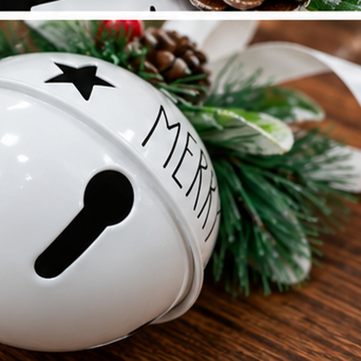 White Metal Jingle Bell Christmas Ornament with "MERRY" & Frosted Greenery – festive tabletop holiday display