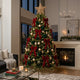 2026 designer Christmas tree styling with emerald green, black and gold luxury baubles and woven rattan star - Cool Budget