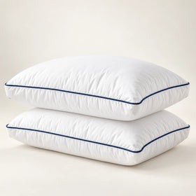 Two white Cool Budget gel-feel gusseted pillows with navy piping