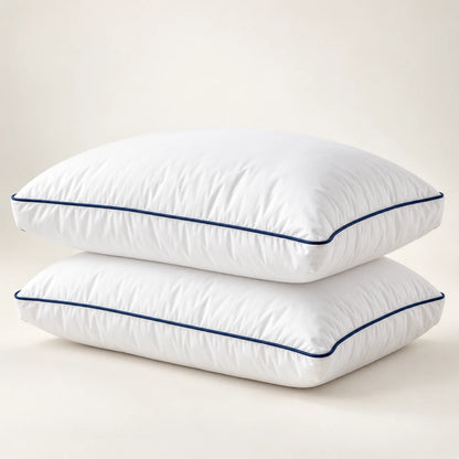 Two white Cool Budget gel-feel gusseted pillows with navy piping