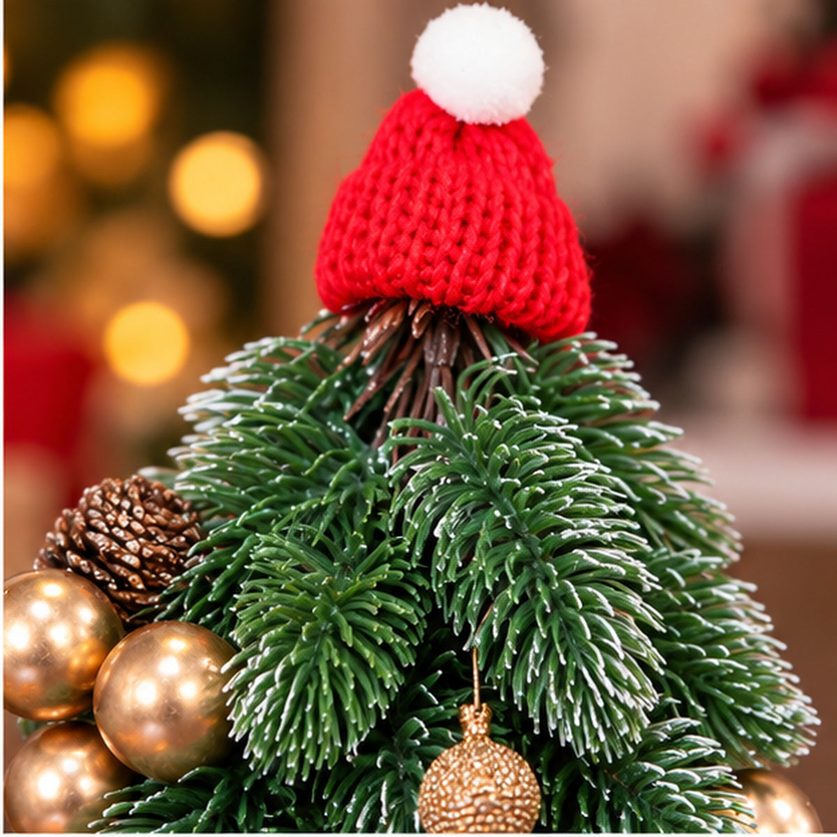 Tabletop Decorated Mini Christmas Tree with Santa Hat & Pot Base – knitted red Santa hat and foliage closeup
